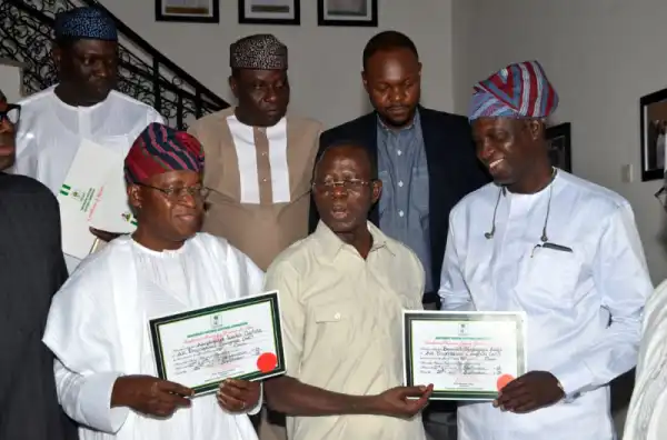 Gboyega Oyetola Presents His Certificate Of Return To Adams Oshiomole (Photos)